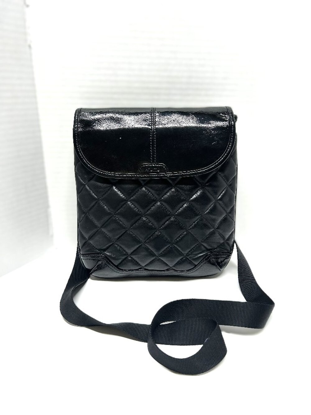 Knomo Sofia black quilted foldover cross-body bag